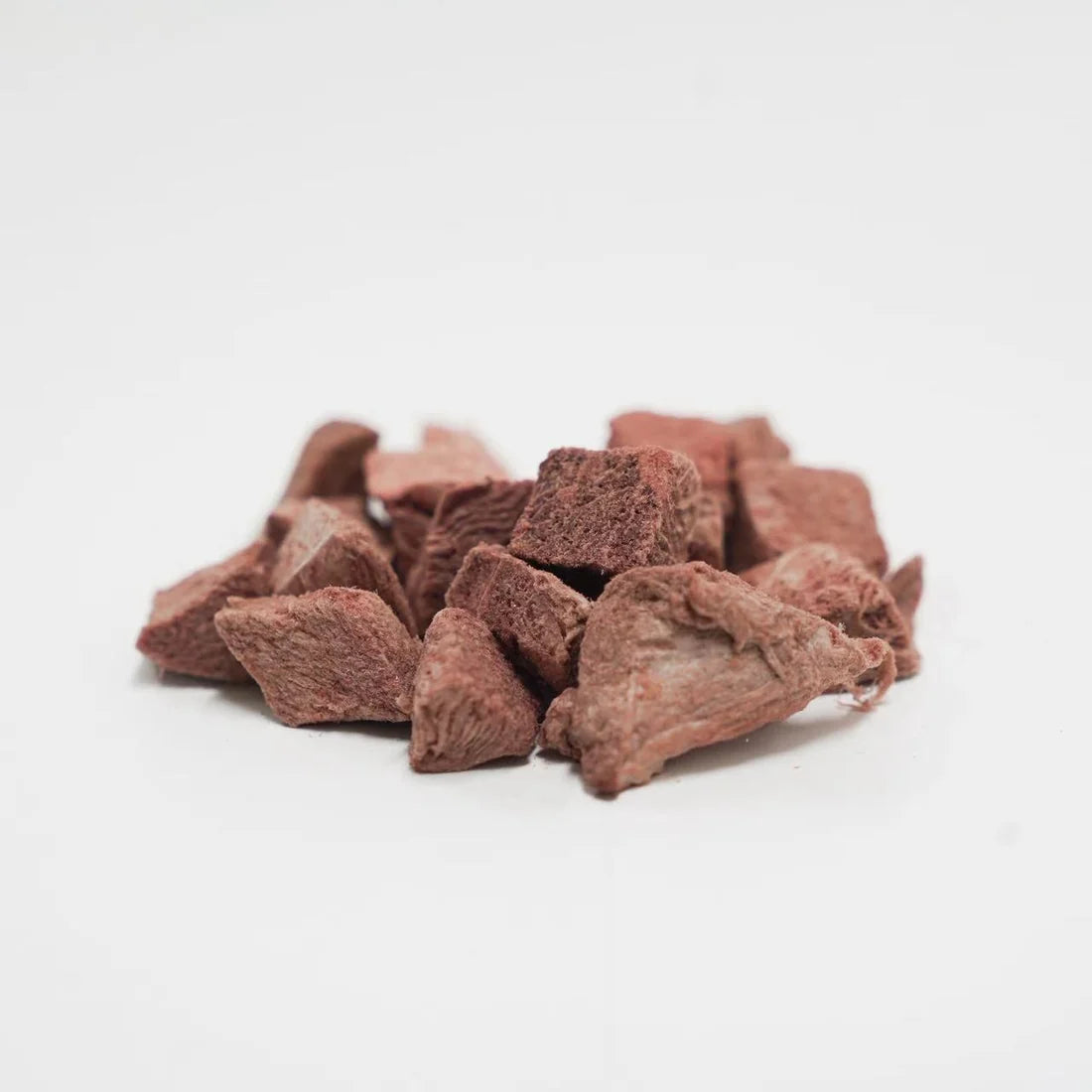 Close-up of Rafa Treats freeze-dried venison steak chunks, showing the natural texture of the premium Australian meat pieces on a white background.