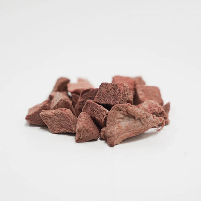 Close-up of Rafa Treats freeze-dried venison steak chunks, showing the natural texture of the premium Australian meat pieces on a white background.