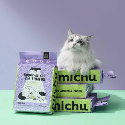 A beautiful fluffy Ragdoll cat resting comfortably on top of a stack of four purple Michu Super-Mixed Tofu Cat Litter bags against a clean pastel background.