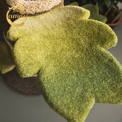 A close-up view of the green leaf-shaped platform on the Camily cat tree, showcasing the high-durability, imported nylon fiber plush that resists vigorous scratching.