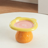 Top-down view of the wide, shallow 15cm yellow and pink Teddy Bear ceramic pet dish, perfectly engineered for flat-faced cats and small dogs to eat comfortably.
