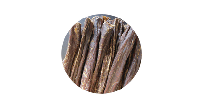 Close-up circular view of 100% pure air-dried beef jerky sticks for dogs, highlighting the natural, high-protein chewy texture perfect for training rewards.