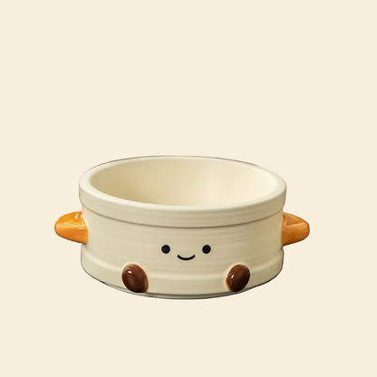 Full product view of the Dim Sum Steamer Ceramic Pet Bowl on a clean cream background, highlighting its smooth glaze, ribbed steamer texture, and adorable smiley face design.
