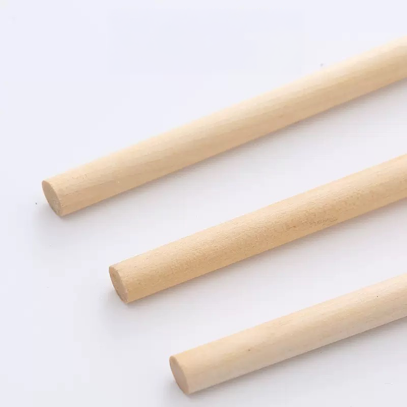 Close-up of three smooth, solid natural wood handles used for LéJoyee cat teaser wands, highlighting their minimalist and earth-toned design that looks beautiful in any living room.