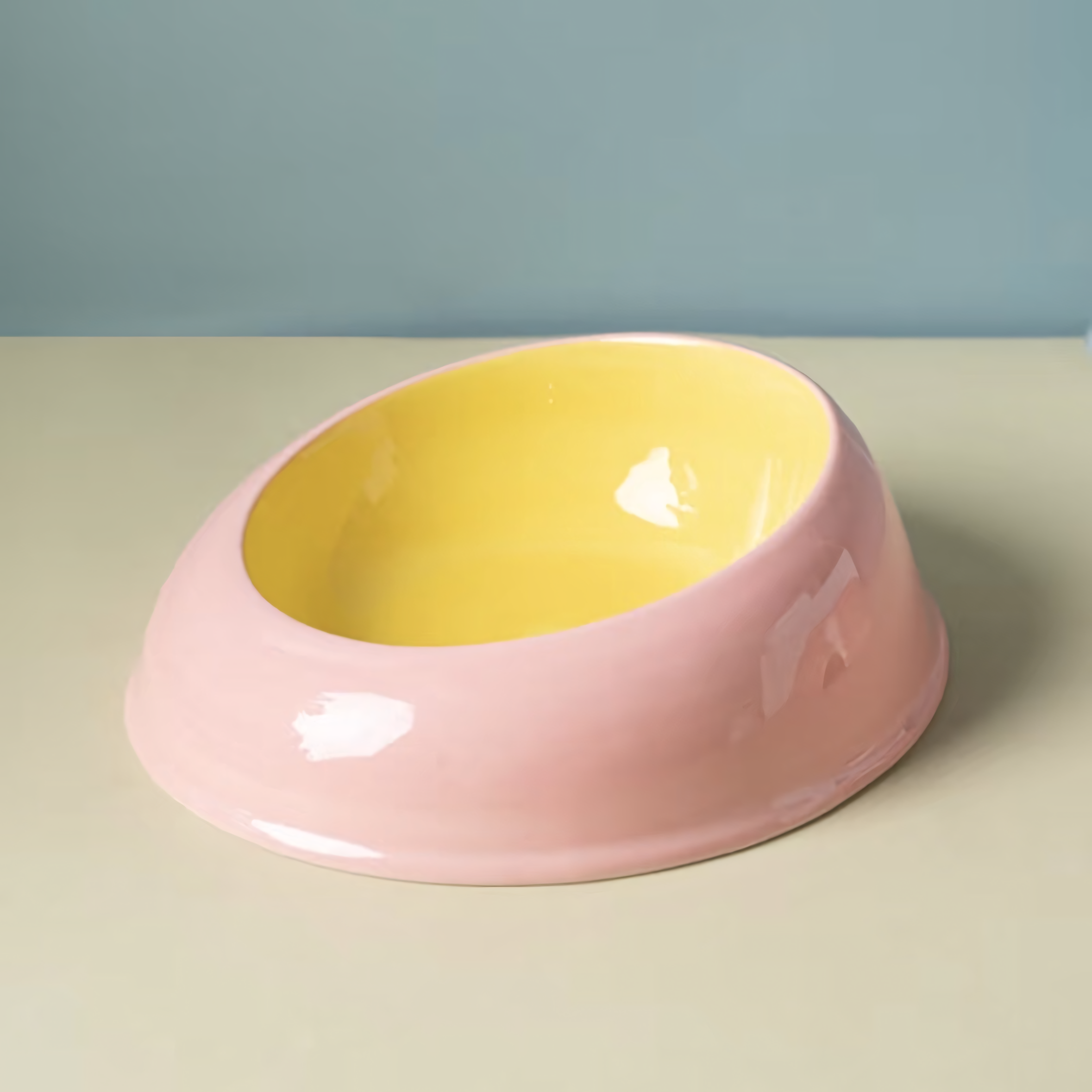 A cute Strawberry Pink and Butter Yellow two-tone ceramic cat bowl. The smooth, heavyweight 440g design prevents tipping and sliding during mealtime.