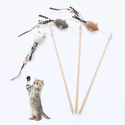 A cute tabby kitten standing on its hind legs reaching up to catch three floating plush mouse teaser wands, demonstrating the erratic bounce that triggers deep-rooted hunting instincts.