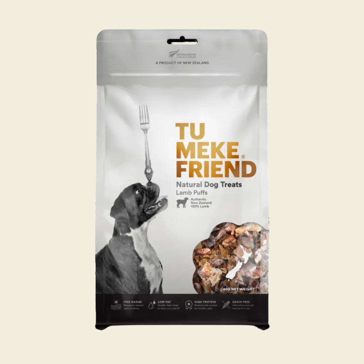 Front packaging of TU MEKE FRIEND Air-Dried Lamb Puffs (80g), featuring a beagle dog balancing a fork and a transparent window displaying the light, airy lamb lung treats.