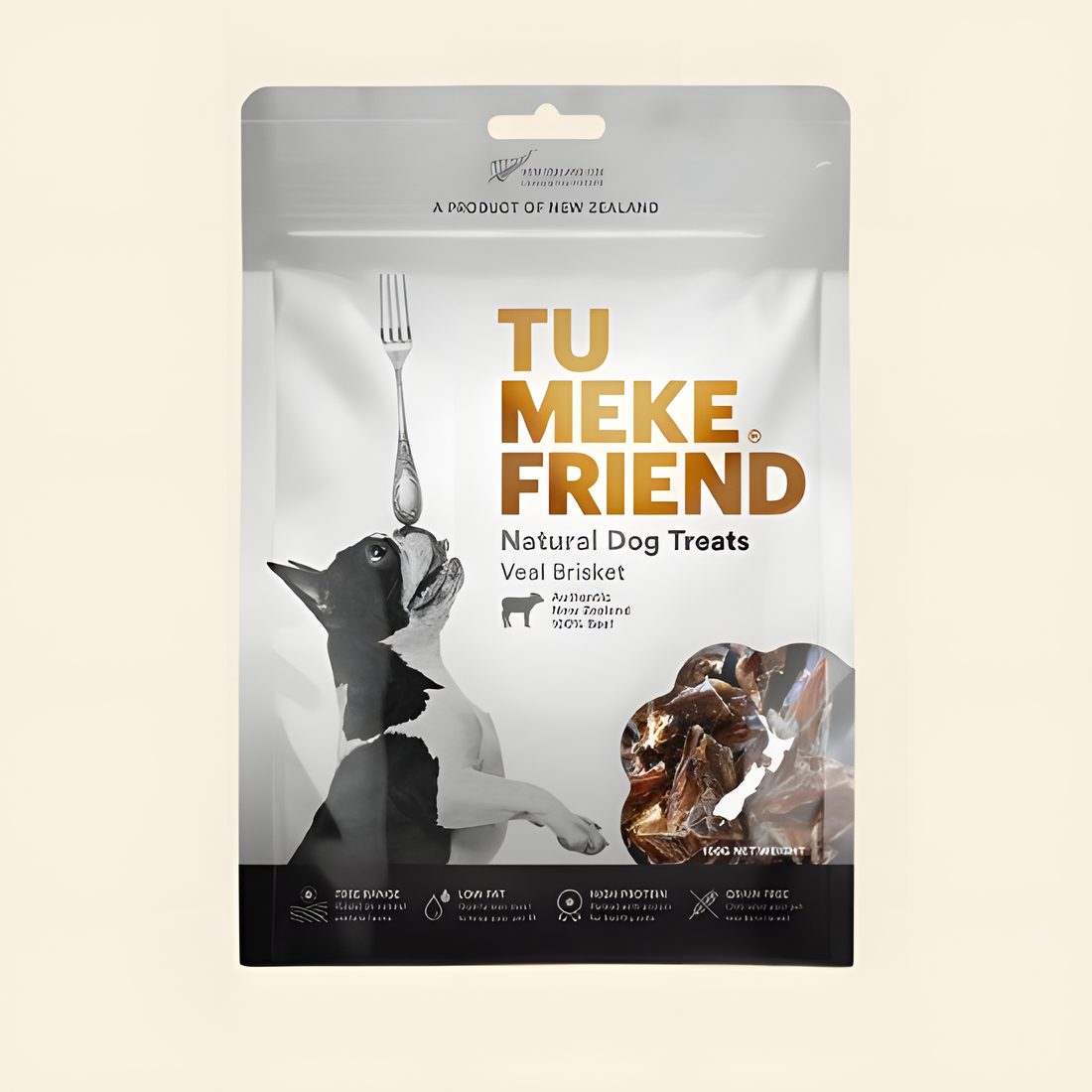 Front packaging of TU MEKE FRIEND Air-Dried Veal Brisket (100g), featuring a dog balancing a fork and a clear window displaying the high-protein natural treats inside.