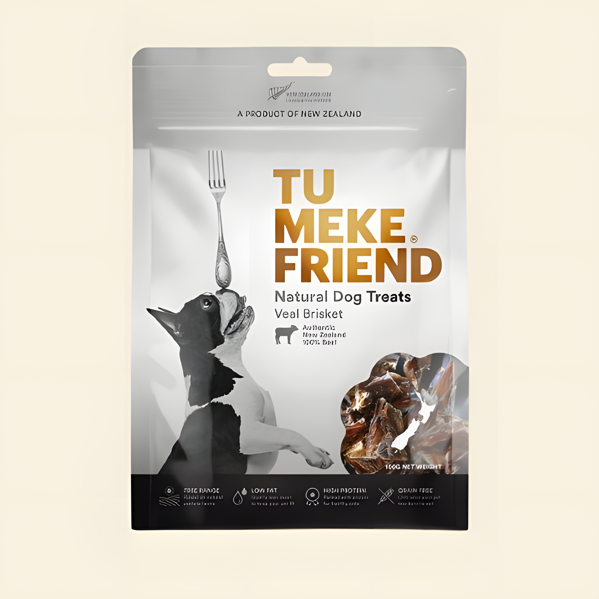 Front packaging of TU MEKE FRIEND Air-Dried Veal Brisket (100g), featuring a dog balancing a fork and a clear window displaying the high-protein natural treats inside.
