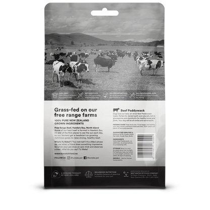The back of the TU MEKE FRIEND Beef Paddywack pouch, detailing the guaranteed analysis with 91.8% protein, natural glucosamine and chondroitin for joint health, and safe feeding guidelines.
