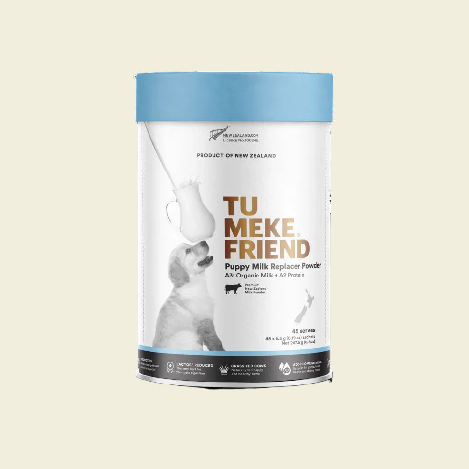 Front packaging box of TU MEKE FRIEND Puppy Milk Replacer Powder, featuring a puppy and highlighting the Organic A3 Milk, Omega-3 DHA, and Probiotic ingredients.