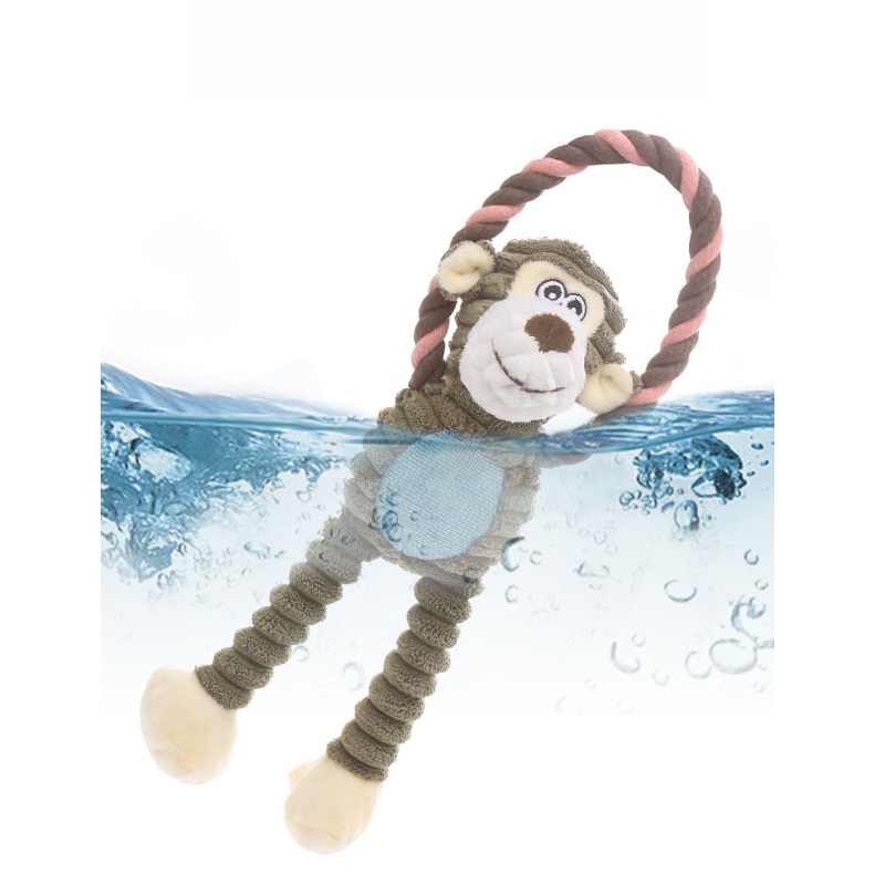 The Cheeky Monkey corduroy dog toy partially submerged in water, demonstrating that it is fully washable, hygienic, and colorfast after heavy play.