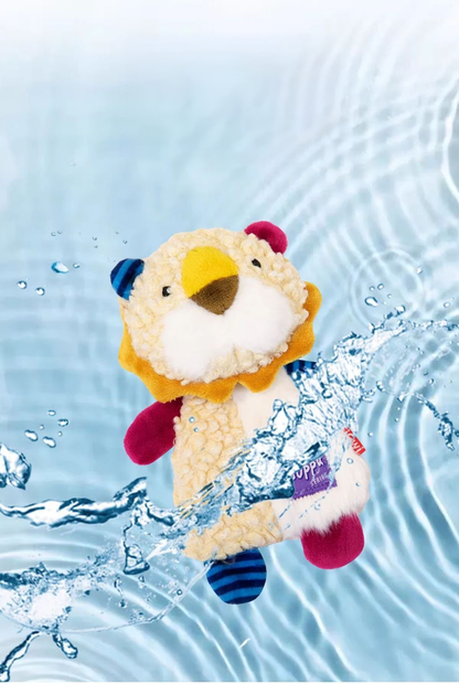 The plush lion dog toy displayed with dynamic water splash graphics and ripples, demonstrating that the calming security blanket toy is fully washable and easy to clean.