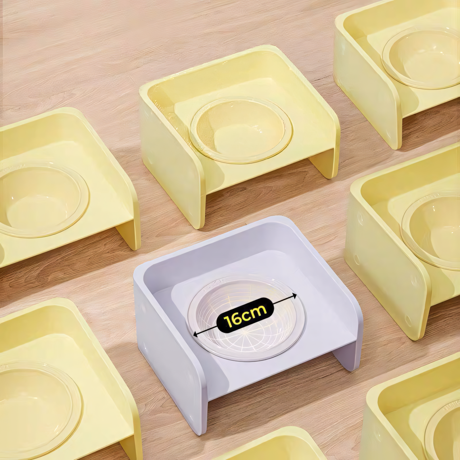 A top-down view of a purple Mango elevated pet bowl surrounded by yellow ones, highlighting the generous 16cm wide ceramic bowl opening to prevent whisker fatigue.