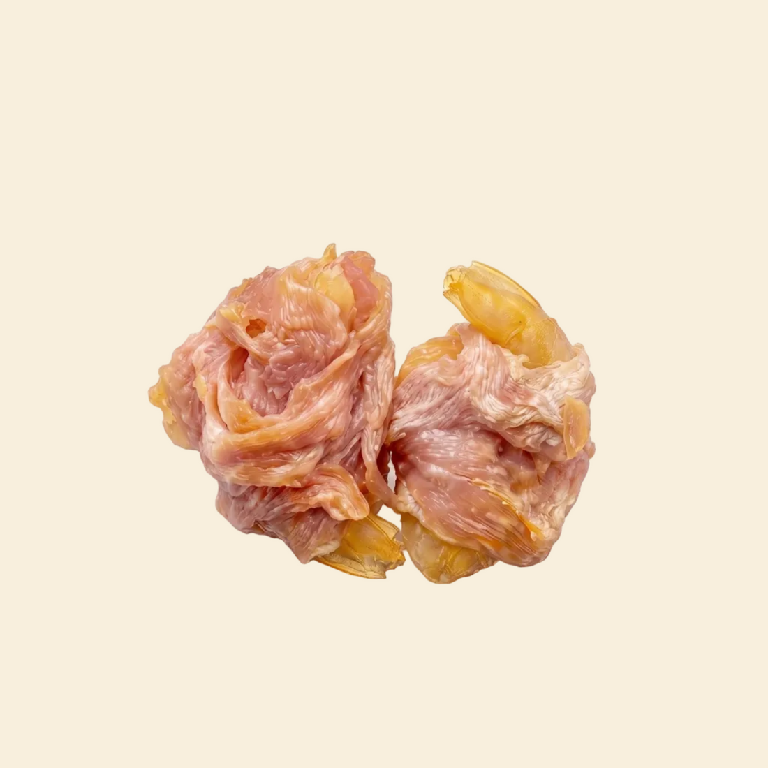 Close-up detail of two air-dried pet treats featuring whole succulent prawns wrapped in premium lean chicken breast. Showcasing the chewy texture and intense natural aroma of this 55% protein dual-protein snack.