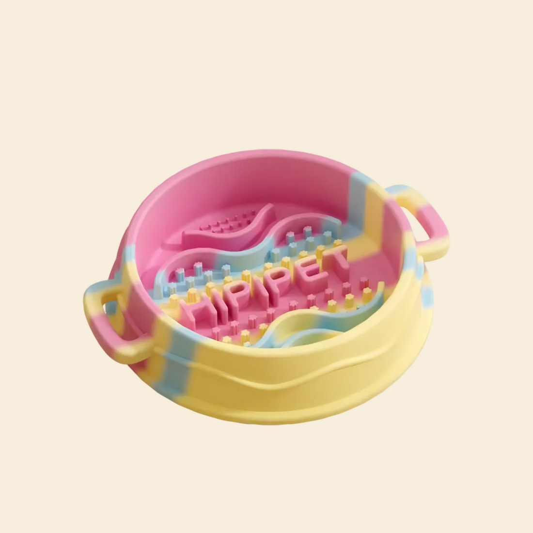 A Wiz Pink silicone slow feeder bowl on a wooden floor, featuring an inset graphic of the complimentary cleaning brush designed to reach every nook and cranny.
