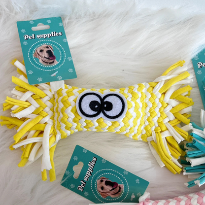 The yellow variant of the Woven Candy Squeaky Toy. It highlights the unique woven fabric strips, the charming wrapped candy design, and the built-in squeaker.
