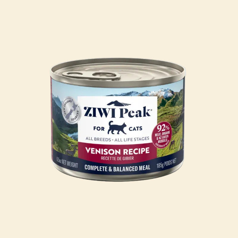 Front view of the 185g ZIWI Peak Venison Recipe can, featuring a New Zealand landscape background. The label indicates this novel protein recipe is suitable for cats of all breeds and life stages.